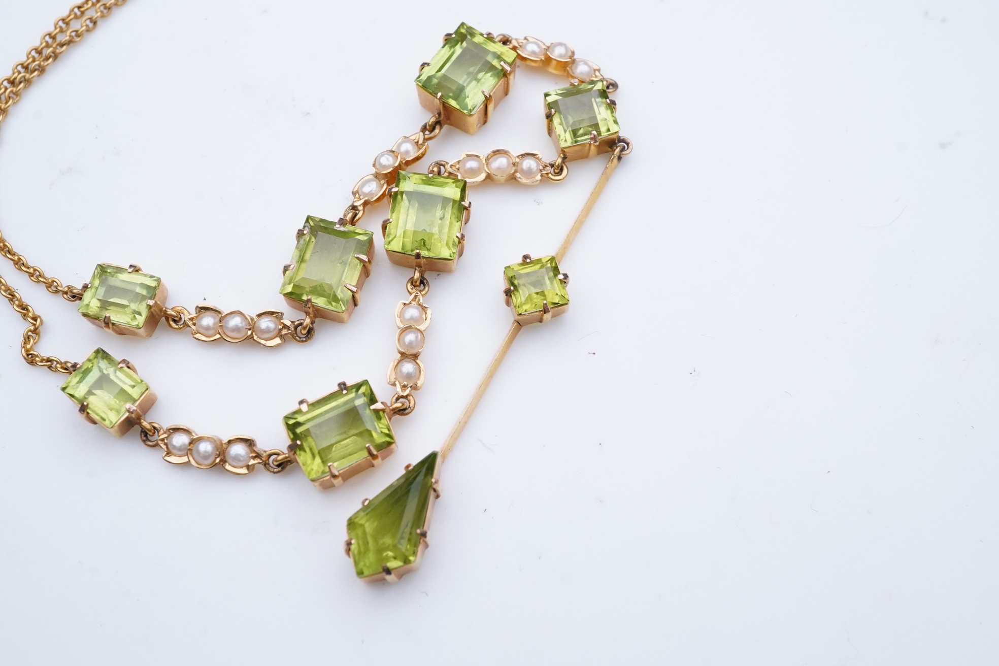 An Edwardian peridot and seed pearl necklace, early 20th century